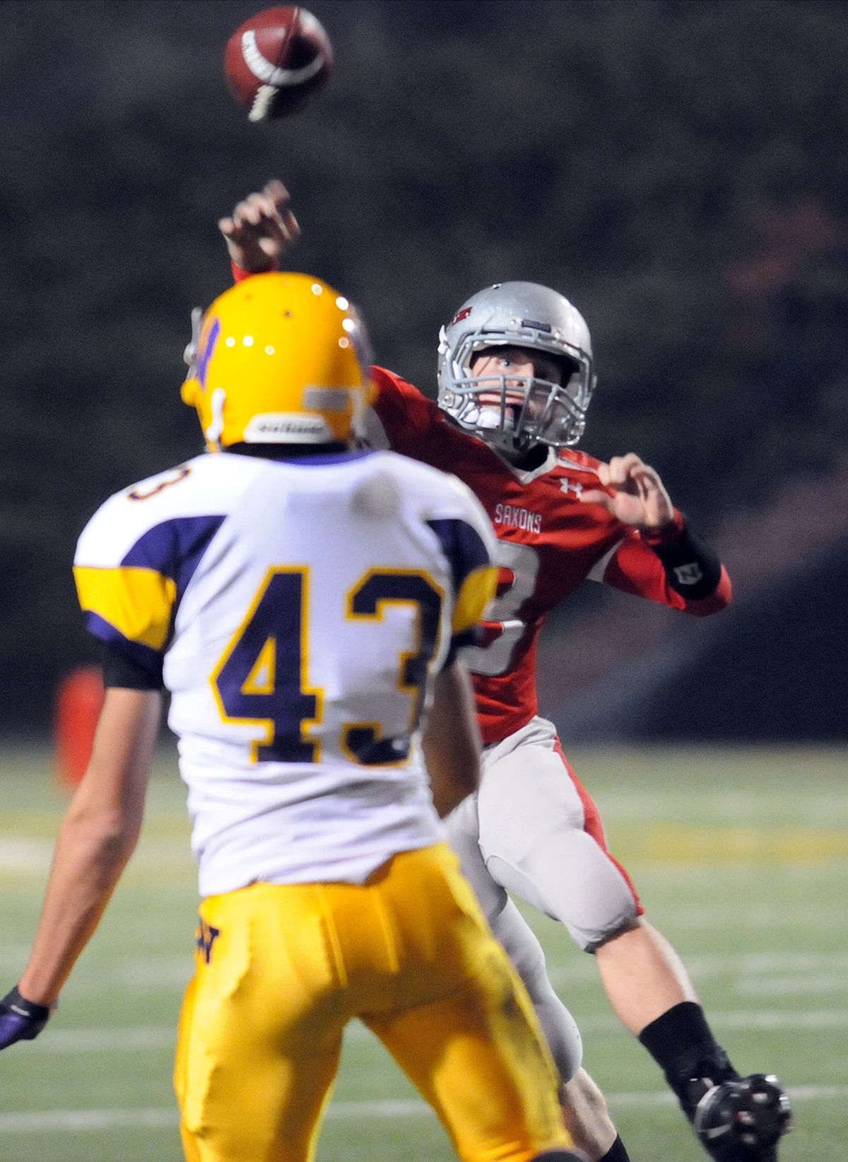 Ferris quarterback Ben Goodwin lets a pass fly before he is caught by Wenatchee