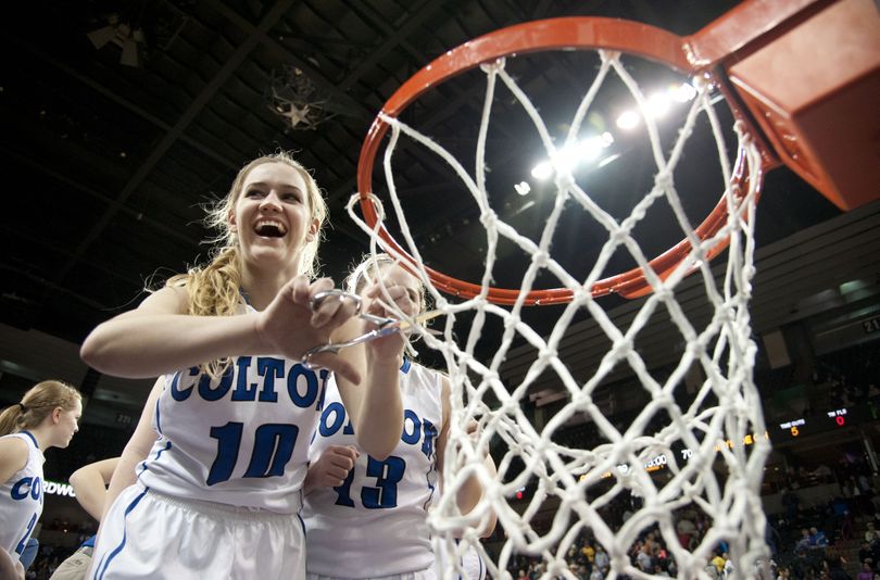 Colton's Zoe Moser, who scored 35 points on Saturday, cuts the net in celebration at the Arena. (Dan Pelle)