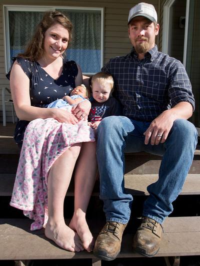 The Underdahl family poses for a portrait on Tuesday in the backyard of their Post Falls home. Pictured from left to right: Ashton, Aurelia, Archer and Scott. Aurelia is the first girl to be born to the Underdahl lineage in 101 years. (Jake Parrish/Coeur d'Alene Press photo)