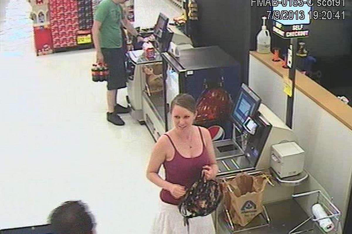 A female suspect is shown in surveillance footage from the Millwood Albertsons grocery store on July 9, 2013. The Spokane County Sheriff