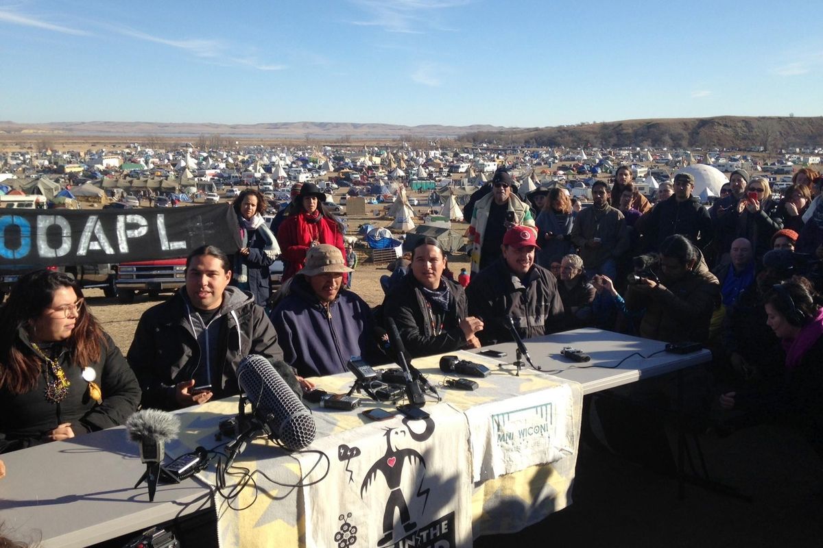 Organizers of protests against construction of the Dakota Access oil pipeline speak at a news conference on Saturday, Nov. 26, 2016, near Cannon Ball, N.D. They said they have a right to remain on land where they have been camped for months. (James MacPherson / Associated Press)