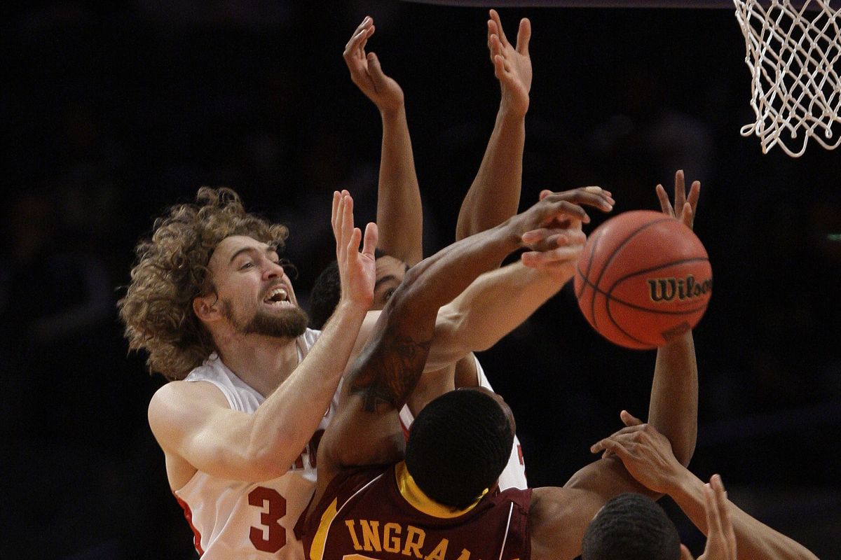 Stanford’s Andrew Zimmermann, left, fights for a rebound with Minnesota’s Andre Ingram in the NIT title game at Madison Square Garden. (Associated Press)