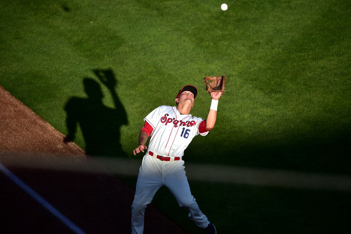 Spokane third baseman Dean Long skirts the foul line to catch a popup at Avista Stadium on Wednesday. (TYLER TJOMSLAND PHOTOS)