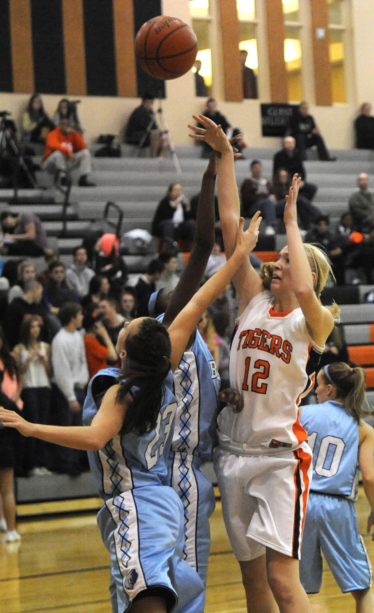 Emma Keenan of LC fires a short jumper over CV’s Molly Barnhart (23) and Mariah Cunningham. (Jesse Tinsley)