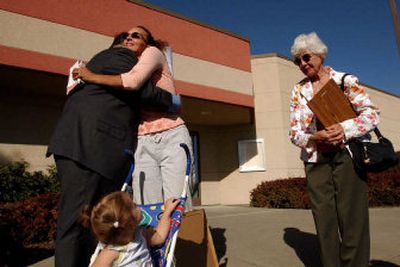 
Beaumont Police Officer Mitch White, left and Charla Sparks, far right, traveled from Beaumont, Calif., to thank Coeur d'Alene Denny's waitress Amber Deahn, center, for helping to capture Joseph Duncan, who has been linked to the murder of Anthony Martinez. White was the lead investigator for the Martinez murder case and Sparks was Anthony's third-grade teacher. Also in the photo is Deahn's daughter, Maria Deahn, 16 months. 
 (Kathy Plonka / The Spokesman-Review)