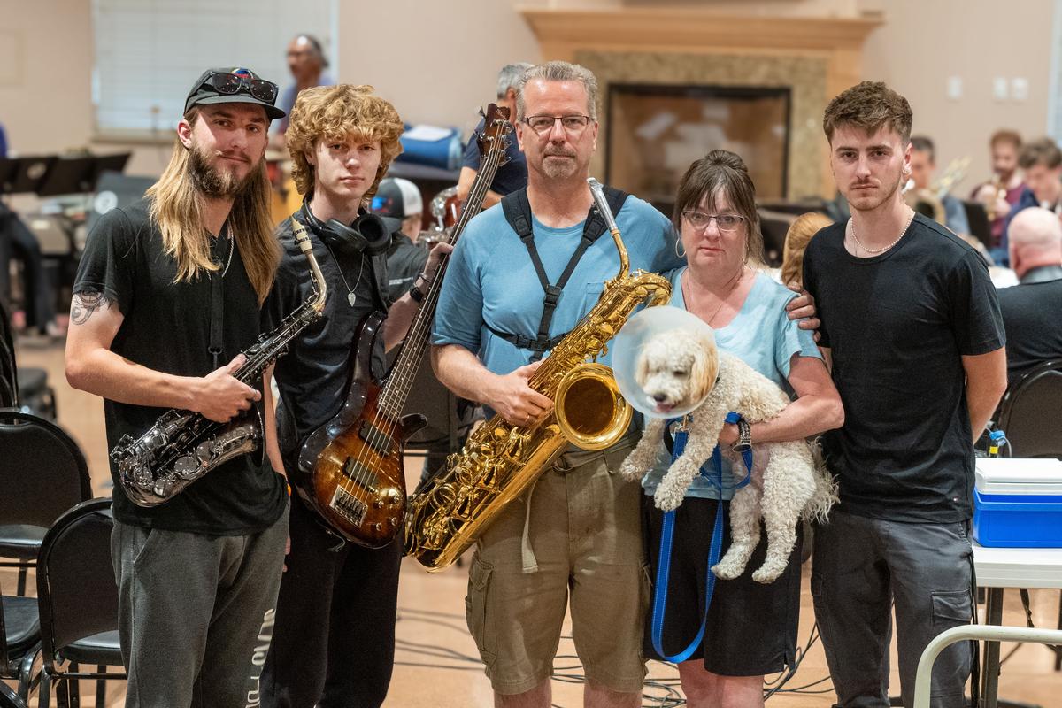 The Moyer family, from left, Camden, Conlin, dad Chris, mom Andren, holding dog Grover, and Carson take a break from Master Class Big Band practice on Thursday in Spokane. (COLIN MULVANY/THE SPOKESMAN-REVIEW)