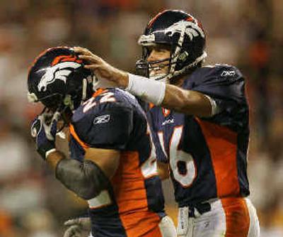 
Jake Plummer (16) and Quentin Griffin led the Denver Broncos past the Kansas City Chiefs.
 (Associated Press / The Spokesman-Review)