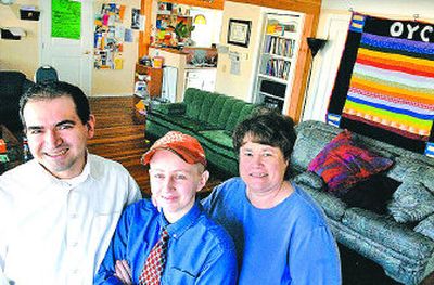 
Odyssey Youth Center's Ramon Alvarez, executive director, left, Kelly Stevens, volunteer facility coordinator, and Ann Marie Floch, volunteer youth program coordinator, gather at the center. 
 (Jed Conklin / The Spokesman-Review)