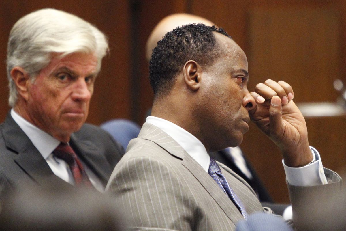 Conrad Murray wipes a tear during the defense opening arguments in his involuntary manslaughter trial Tuesday in Los Angeles. (Associated Press)