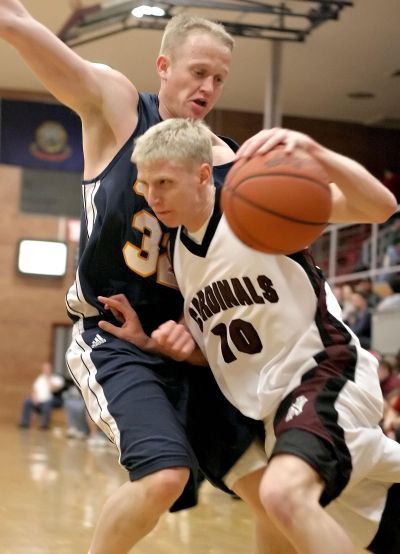 NIC’s Scott Stockwell drives to the hoop against Snow’s Chris Hoopes in a game at NIC on Feb. 10, 2007. (File/The Spokesman-Review)
