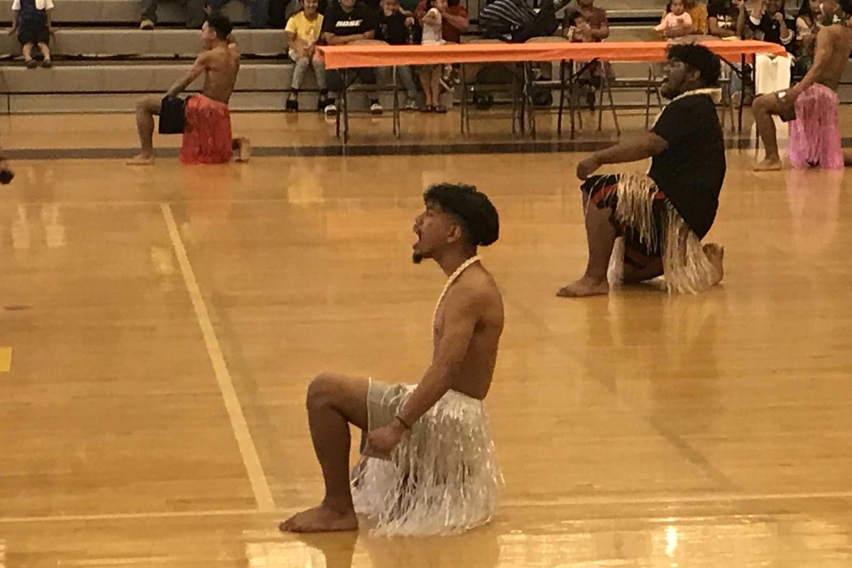 A group of male Marshallese students perform a Roro, a traditional Marshallese chant, and danced across the gym floor as they bellowed the chant on Manit Day, Saturday, May 18, 2019, at Rogers High School in Spokane. The third annual Manit Day celebrates Marshallese traditions and recognizes the achievements of Marshallese students across Spokane County. (Nina Culver / The Spokesman-Review)