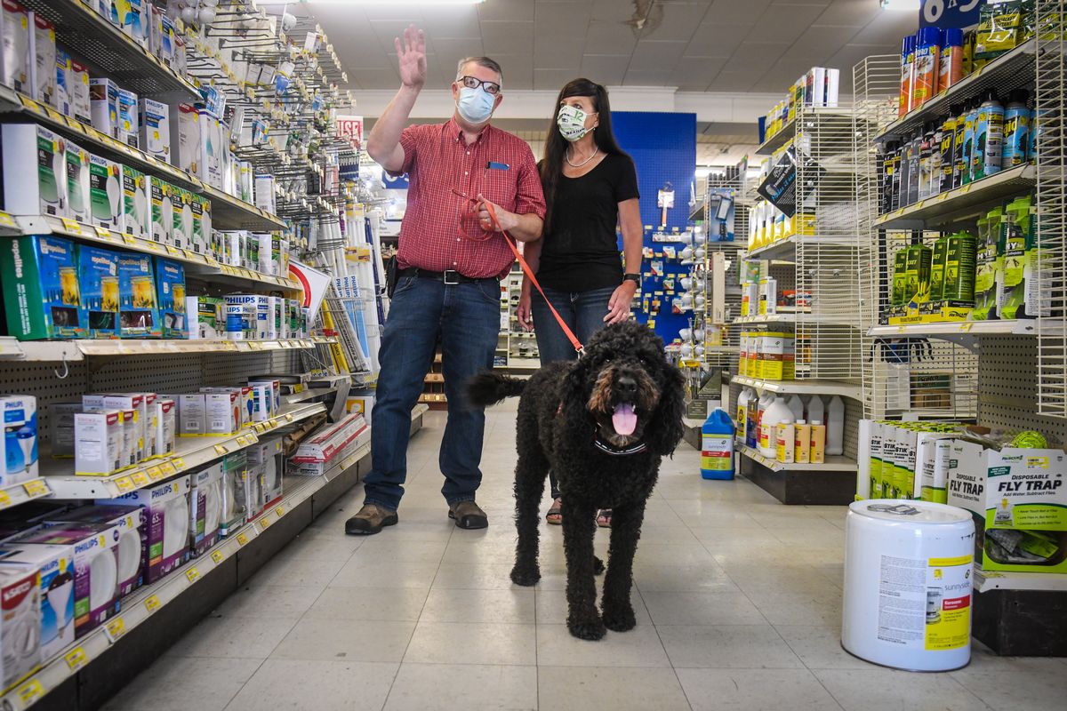 Stace Heston, along with his wife, Arlene, and dog, Cooper, shows the area where the seasonal items will be displayed when they reopen Miller’s Hardware Store. The Hestons have bought the business and will be updating the inside and painting the exterior.  (DAN PELLE/THE SPOKESMAN-REVIEW)