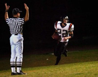
Running back Ethen Robinson scores a touchdown for Lewis and Clark.  
 (Holly Pickett / The Spokesman-Review)