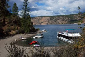 Beach camping is popular during summer in Lake Roosevelt National Monument. House boats have built-in toilets, while tent campers are supposed to bring portable toilets and pack out their human waste.  (Rich Landers / The Spokesman-Review)