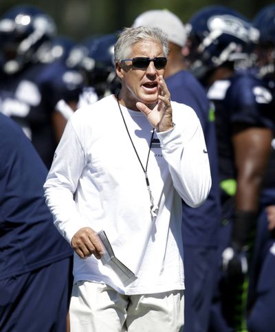 The Seahawks and coach Pete Carroll were penalized for too much contact during minicamp. (Associated Press)