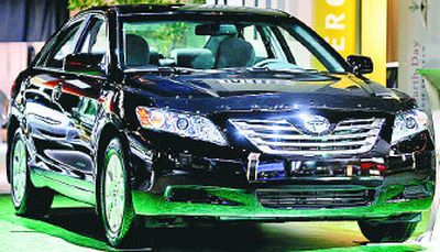 
The new Toyota hybrid Camry is seen during media preview day at the Toronto International Auto Show. 
 (Associated Press / The Spokesman-Review)
