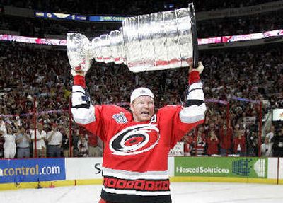 
Glen Wesley hoists the Stanley Cup after Carolina won Game 7. 
 (Associated Press / The Spokesman-Review)