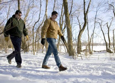 
Brothers Jim, left, and Rink DaVee walk on a snow-covered trail on Wednesday, in Madison, Wis., which  Prevention magazine has named  the most walkable of the country's 100 most populated cities. 
 (Associated Press / The Spokesman-Review)