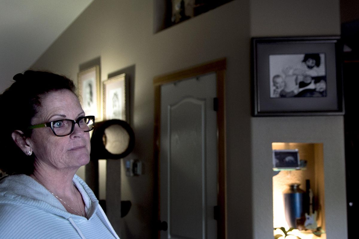 FILE – Patty Fowler pictured near a memorial dedicated to her son Cory Fowler at her home in Athol, Idaho on Friday, September 2, 2016. “I just couldn’t quit crying, my son isn’t supposed to be dead,” she said. (Kathy Plonka / The Spokesman-Review)