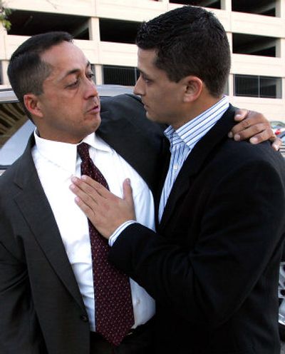 
Former U.S. Border Patrol agent Ignacio Ramos, left, is consoled by an unidentified man outside the U.S. Federal Courthouse, Thursday  in El Paso, Texas. 
 (Associated Press / The Spokesman-Review)