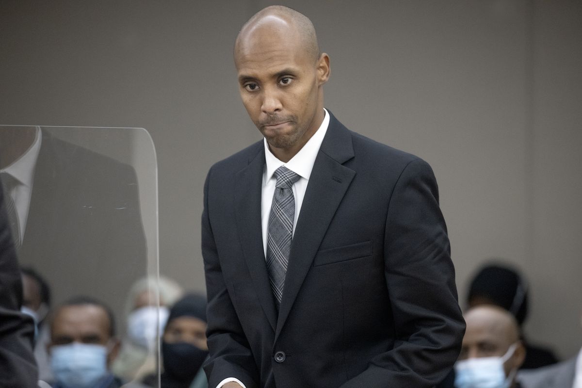 Former officer Mohamed Noor makes his way to the podium to address Judge Kathryn Quaintance at the Hennepin County Government Center, Thursday, Oct. 21, 2021 in Minneapolis. The Minneapolis police officer who fatally shot an unarmed woman after she called 911 to report a possible rape happening behind her home was sentenced Thursday to nearly five years in prison — the most the judge could impose but less than half the 12½ years he was sentenced to for his murder conviction that was overturned last month.  (Elizabeth Flores)