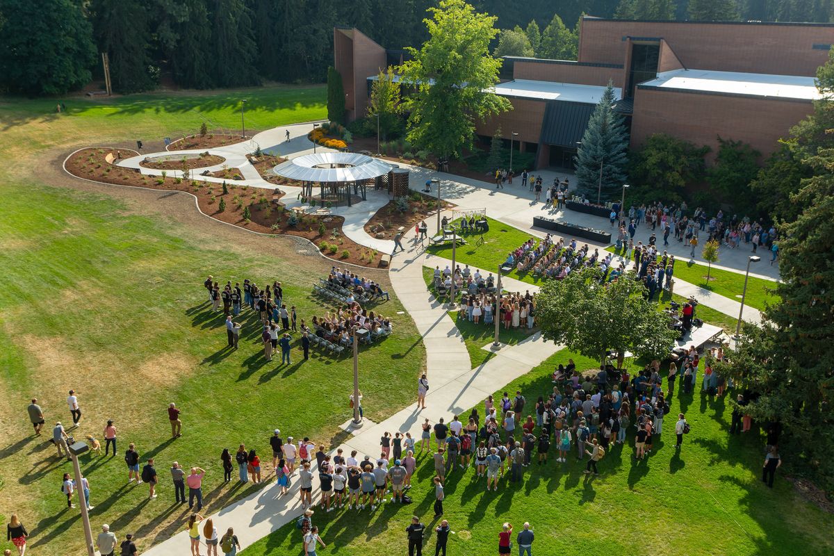 A crowd gathers for the dedication of the Vandal Healing Garden and Memorial on Wednesday, Aug. 21, 2024, at the University of Idaho in Moscow. The garden was built in remembrance of all UI students who have died, with special memorials for Ethan Chapin, Xana Kernodle, Madison Mogen and Kaylee Goncalves.  (Geoff Crimmins/For The Spokesman-Review)