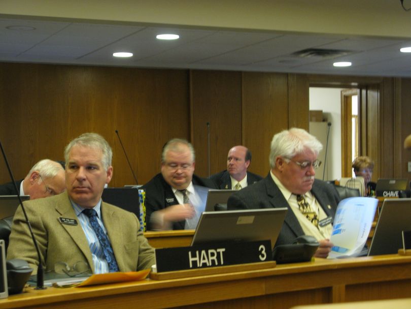 The Idaho House, including Reps. Phil Hart, R-Athol, Russ Mathews, R-Idaho Falls, and Steve Hartgen, R-Twin Falls, debates a highway bonding bill on Friday morning; the bill passed, despite strong debate against it. (Betsy Russell / The Spokesman-Review)