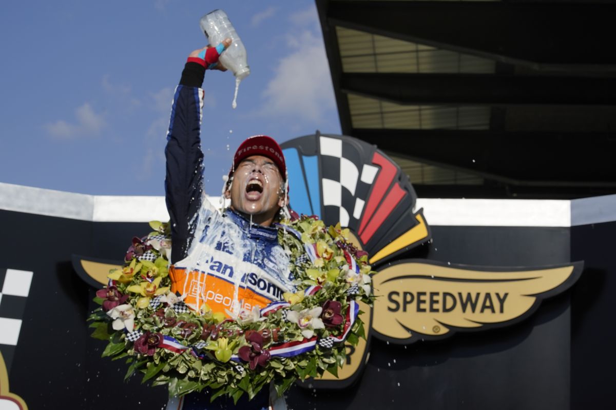 Takuma Sato of Japan celebrates after winning his second Indianapolis 500 on Sunday.  (Michael Conroy)