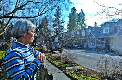 
Lynn Morris can appreciate the architecture and quality of the new condo development across from her home in the Sanders Beach neighborhood of Coeur d'Alene, but she and others think there should be some adjustments to the infill ordinance to make projects one more compatible with older neighborhood. 
 (Jesse Tinsley / The Spokesman-Review)