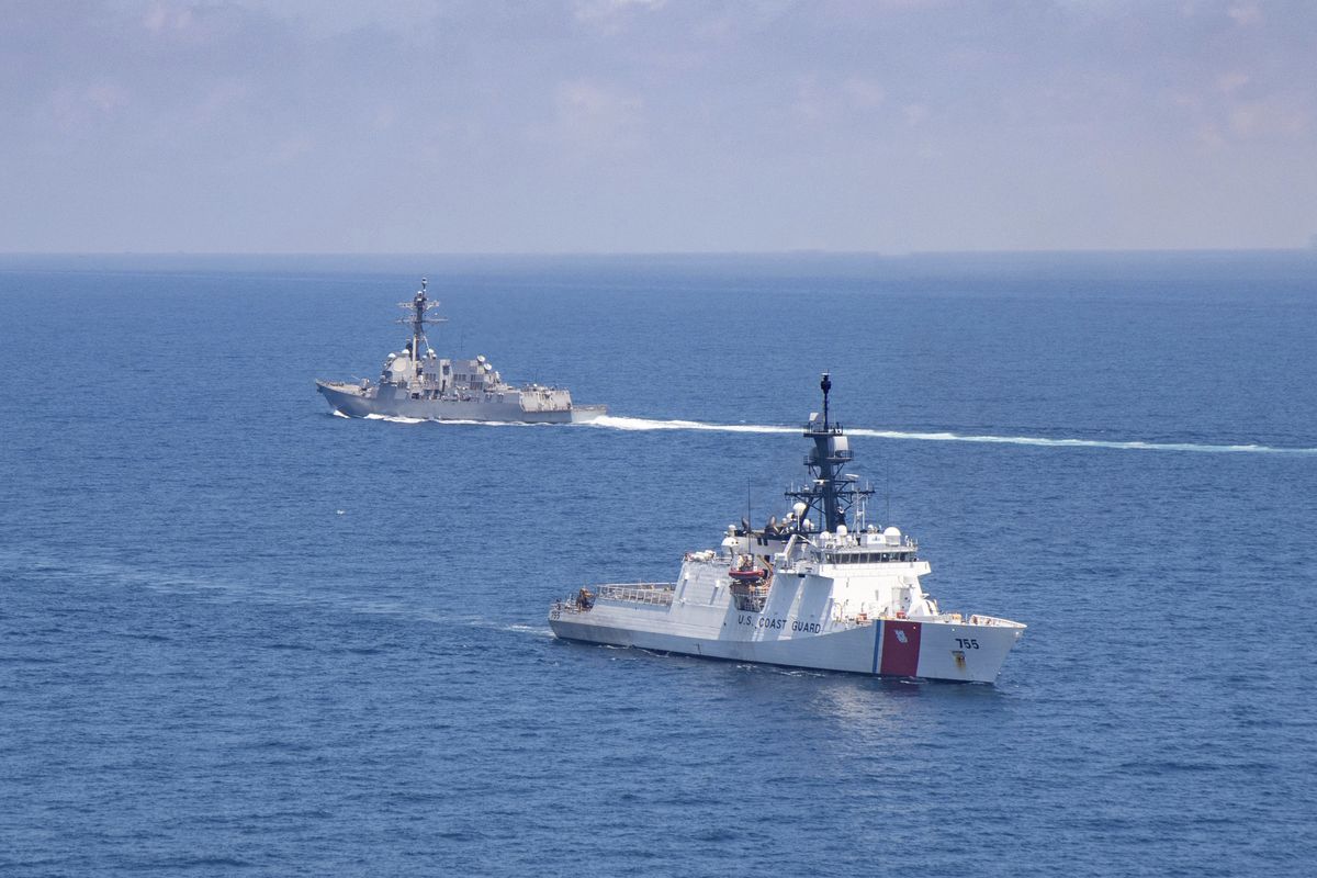 FILE - In this Aug. 27, 2021, file photo provided by U.S. Coast Guard, Legend-class U.S. Coast Guard National Security Cutter Munro (WMSL 755) transits the Taiwan Strait during a routine transit with Arleigh Burke class guided-missile destroyer USS Kidd (DDG 100). North Korea on Saturday, Oct. 23, accused the Biden administration of raising military tensions with China with its “reckless” backing of Taiwan and claimed that the growing U.S. military presence in the region poses a potential threat to the North.  (HOGP)