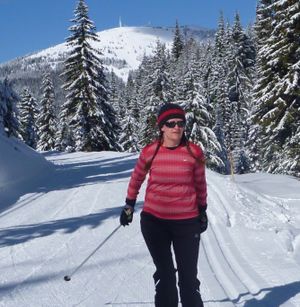 Holly Weiller of Spokane enjoys the skate skiing on the Mica Road Trail with Mount Spokane in the background. (Rich Landers)