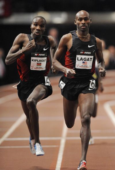 Kenya’s Silas Kiplagat, left, prepares to pass Bernard Lagat in the 1-mile run on Saturday. (Associated Press)
