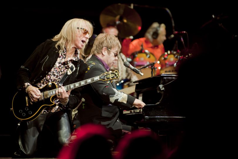 During the opening song, music director and band member Davey Johnstone joins Elton john in singing 
