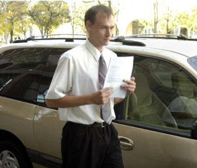 
Kenneth Wade Pearson leaves U.S. District Court in downtown Spokane on Tuesday after pleading guilty to federal charges of conspiracy to commit wire and mail fraud and receipt of child pornography. 
 (Dan Pelle / The Spokesman-Review)