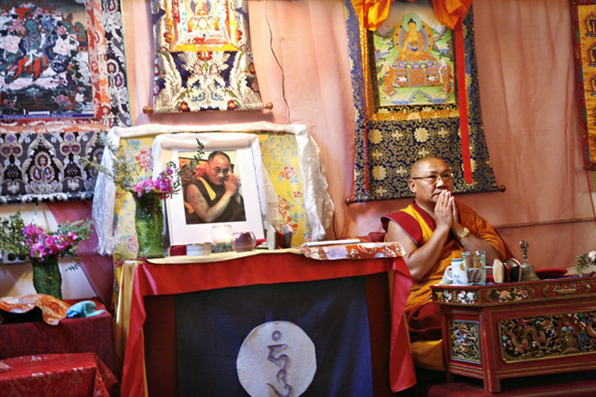 Venerable Geshe Thupten Phelgye, shown here teaching in a shrine room with a photo of the Dalai Lama, is a parliament member of the Tibetan government-in-exile. Photo courtesy of Steve Solinsky (Photo courtesy of Steve Solinsky / The Spokesman-Review)