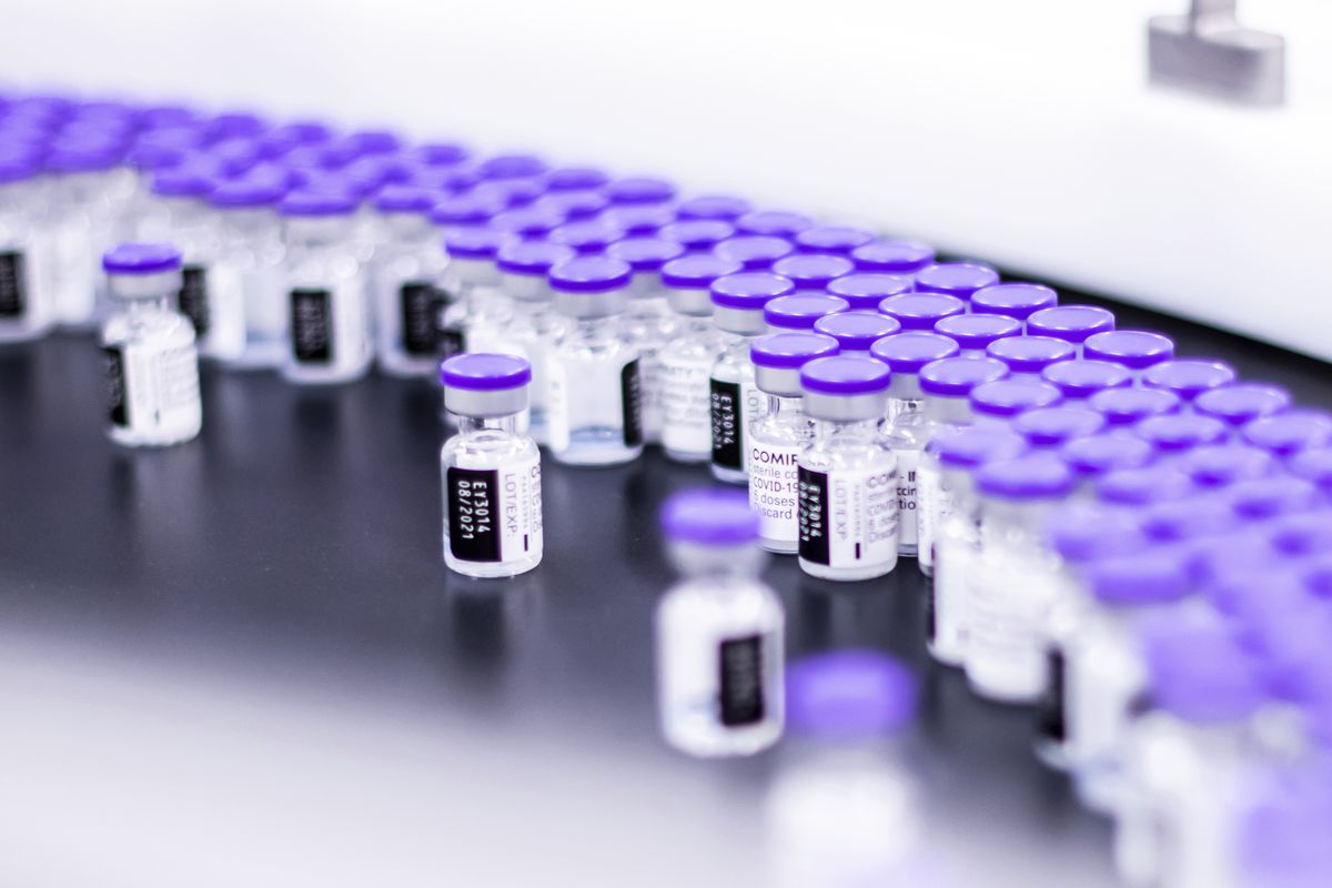 In this March 2021 photo provided by Pfizer, vials of the Pfizer-BioNTech COVID-19 vaccine are prepared for packaging at the company’s facility in Puurs, Belgium. Pfizer is about to seek U.S. authorization for a third dose of its COVID-19 vaccine, saying Thursday, July 8, 2021, that another shot within 12 months could dramatically boost immunity and maybe help ward off the latest worrisome coronavirus mutant.  (HONS)