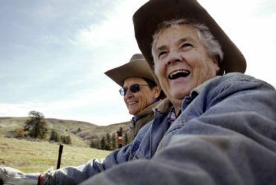 
Carol Shultz, right, and Bev Martin head off to work on a cool spring morning in April, sharing an ATV loaded with posts and barbed wire near Ola, Idaho. 
 (Photos by Darin Oswald Idaho Statesman / The Spokesman-Review)