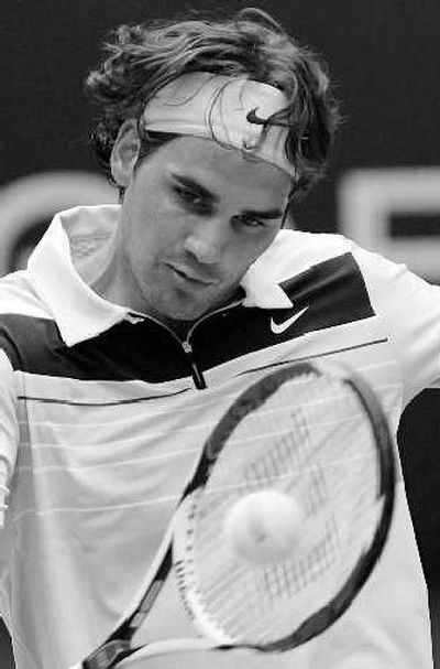 
Switzerland's Roger Federer  is through to the third round.
 (Associated Press / The Spokesman-Review)