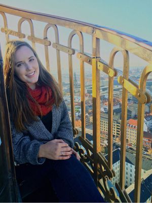 Kylie Mohr, at the top of a church spire, Vor Frelsers Kirke (Church of Our Saviour) overlooking central Copenhagen. Photo by Ina Deljkic