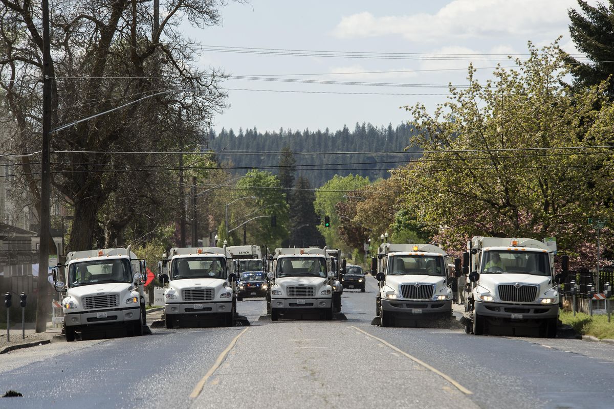 City street crews wash and sweep Broadway Avenue on Sunday May 7, 2017, after thousands of runners and walkers competed the 41st Bloomsday. (Dan Pelle / The Spokesman-Review)