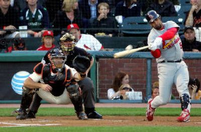 
St. Louis' Albert Pujols belts his 23rd home run, a three-run blast in the first inning.
 (Associated Press / The Spokesman-Review)