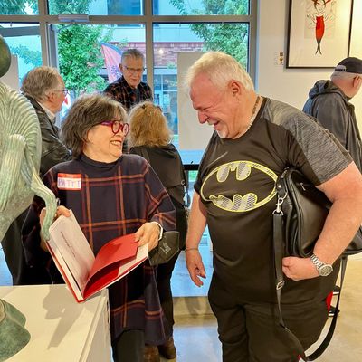 Patti Warashina signs a book at a previous First Friday at Marmot Art Space. She recently won a Smithsonian Visionary Art Award and has work featured in July’s First Friday at the Kendall Yards gallery.  (Courtesy of Marshall Peterson)
