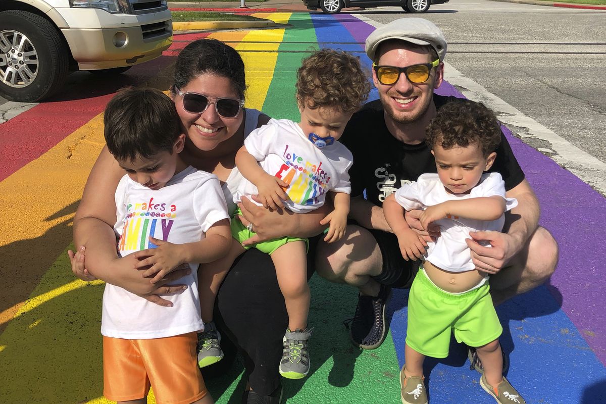 In this undated photo provided by Zahrah Wattier, Wattier, back left, a high school teacher, poses for a photo with her husband, her 4-year-old and 2-year-old twins in Galveston, Texas. As the Trump administration pushes full steam ahead to force schools to resume in-person education, public health experts warn that a one-size-fits-all reopening could drive infection and death rates even higher. Her district had been considering options many others are reviewing: in-person education, full-time online teaching and a hybrid mix.  (HONS)