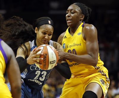 Minnesota Lynx forward Maya Moore, left, drives to the basket against Los Angeles Sparks forward Nneka Ogwumike during the first half in Game 4 of the WNBA basketball finals, Sunday, Oct. 1, 2017, in Los Angeles. (Alex Gallardo / Associated Press)