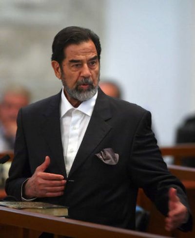 
Former Iraqi leader Saddam Hussein addresses the court during his trial Tuesday.
 (Associated Press / The Spokesman-Review)