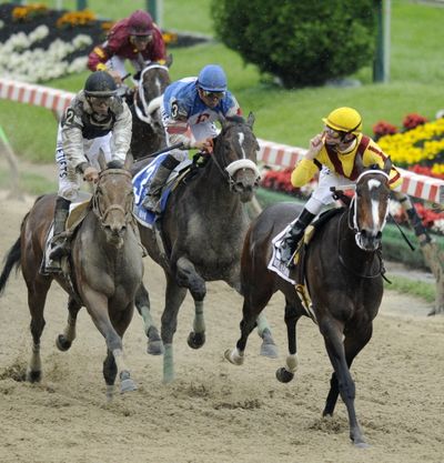  Jockey Calvin Borel, right, gestures after riding Rachel Alexandra to victory in the 134th running of the  Preakness Stakes horse race at Pimlico Race Course on Saturday, May 16, 2009, in Baltimore. Kentucky Derby winner Mine That Bird (2), with jockey Mike Smith aboard finished second, and Musket Man (3) with Eibar Coa riding, finished third.   (The Associated Press)