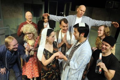 Spokane Civic Theatre’s production of “One Flew Over The Cuckoo’s Nest” features Billy, played by Paul Villabrille, and Candy, played by Nancy Gasper. The two are surrounded by other mental patients during their mock wedding set up by McMurphy, played by George Green, right. The “minister,” a patient named Dale Harding, at center, is played by Thomas Heppler.  (Jesse Tinsley / The Spokesman-Review)