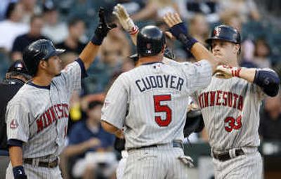 Justin Morneau, right, hit three homers in second game of doubleheader. Associated Press
(Associated Press / The Spokesman-Review)