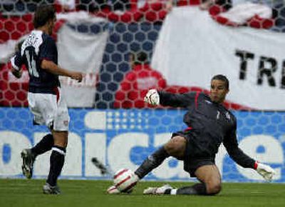 
England goalkeeper David James, right, clears ball in front of Josh Wolff of U.S. 
 (Associated Press / The Spokesman-Review)