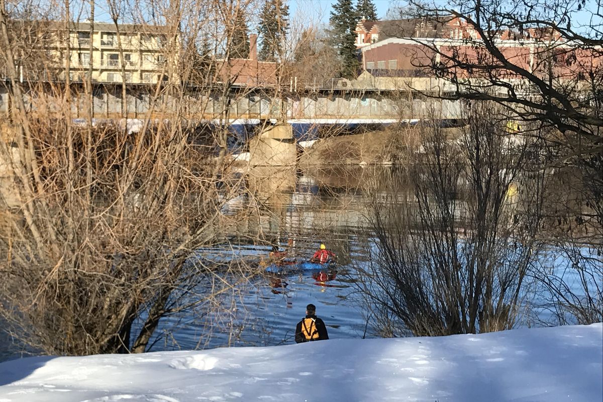 Firefighters were called Wednesday morning to the area of South Riverton Avenue and Desmet Avenue, where they found a car submerged in the Spokane River with nobody inside. (Jonathan Glover / The Spokesman-Review)